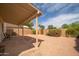 Backyard featuring a covered patio and desert landscaping at 1200 W Boxelder Cir, Chandler, AZ 85224