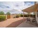 Cozy backyard featuring gravel landscaping, a covered patio and an exterior seating area at 1200 W Boxelder Cir, Chandler, AZ 85224