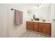 Bathroom with double sink vanity, framed mirror, and modern lighting fixture at 1200 W Boxelder Cir, Chandler, AZ 85224