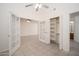 Bedroom featuring tile floors, ceiling fan, french doors and closet at 1200 W Boxelder Cir, Chandler, AZ 85224