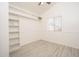 Bright bedroom with white walls, shelving and modern gray flooring at 1200 W Boxelder Cir, Chandler, AZ 85224