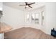 Bright dining area featuring hardwood flooring and an adjacent breakfast bar at 1200 W Boxelder Cir, Chandler, AZ 85224