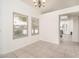 Bright dining area with large windows and tile flooring at 1200 W Boxelder Cir, Chandler, AZ 85224