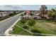 Lovely home near a large grassy area, a white fence, and wide paved street at 1200 W Boxelder Cir, Chandler, AZ 85224
