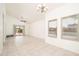 Spacious living room with neutral walls, tile flooring, and access to the patio at 1200 W Boxelder Cir, Chandler, AZ 85224