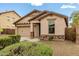 Charming single-Gathering home featuring a well-maintained front yard, desert landscaping, and a two-car garage at 12057 W Ashby Dr, Peoria, AZ 85383