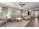 Inviting living room with neutral colors, plush seating, and a ceiling fan for added comfort at 12057 W Ashby Dr, Peoria, AZ 85383
