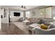 Comfortable living room featuring a large window, modern furniture, and a cozy atmosphere at 12057 W Ashby Dr, Peoria, AZ 85383