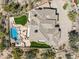 Aerial view of luxury home showcasing sprawling roof, pool and spa in a desert community at 12639 N 136Th St, Scottsdale, AZ 85259