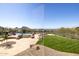Amazing backyard with mountain views, a patio, a built-in pool, and green grass at 12639 N 136Th St, Scottsdale, AZ 85259