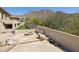 A fire pit sits on the stone paver patio with views of the surrounding mountains at 12639 N 136Th St, Scottsdale, AZ 85259