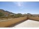 A balcony features picturesque views of the surrounding mountains and natural desert landscape at 12639 N 136Th St, Scottsdale, AZ 85259