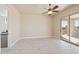 Bright bedroom with tile floors featuring a sliding glass door to the outdoor living space at 12639 N 136Th St, Scottsdale, AZ 85259