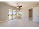 Bright bedroom with tile floors featuring large windows with a view of the landscaped backyard at 12639 N 136Th St, Scottsdale, AZ 85259