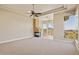 Spacious bedroom boasts a stone fireplace, mountain views and a ceiling fan at 12639 N 136Th St, Scottsdale, AZ 85259