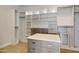Walk-in closet featuring custom shelving and drawers at 12639 N 136Th St, Scottsdale, AZ 85259