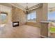 Elegant dining room with a stone fireplace, hardwood floors, and scenic views at 12639 N 136Th St, Scottsdale, AZ 85259