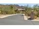 Desert home with tile roof, surrounded by natural desert landscaping and mountains in background at 12639 N 136Th St, Scottsdale, AZ 85259