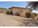 Exterior view of desert home with stucco walls and desert landscaping with mountain views at 12639 N 136Th St, Scottsdale, AZ 85259