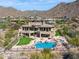Stunning home features a rock-lagoon pool, spa, and mountain views in a desert landscape at 12639 N 136Th St, Scottsdale, AZ 85259