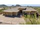 Custom home featuring a three-car garage, tile roof, and desert landscaping at 12639 N 136Th St, Scottsdale, AZ 85259