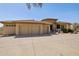 This home features a circular driveway, mature desert landscaping, and a three-car garage at 12639 N 136Th St, Scottsdale, AZ 85259
