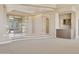 Elegant living area with a glass door entryway and convenient built-in bar area at 12639 N 136Th St, Scottsdale, AZ 85259