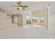 Expansive living room with large windows offering beautiful views, tile floors, and a contemporary ceiling fan at 12639 N 136Th St, Scottsdale, AZ 85259