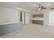 Versatile living area with a wet bar, tile flooring, and ample space for entertaining or relaxing at 12639 N 136Th St, Scottsdale, AZ 85259