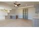 Open concept living room featuring tile flooring, a breakfast bar, and a built in bookcase at 12639 N 136Th St, Scottsdale, AZ 85259