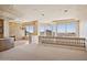 Spacious living room features a stone fireplace, chandelier, and breathtaking views at 12639 N 136Th St, Scottsdale, AZ 85259