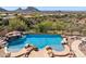 Private pool and spa nestled in a desert landscape with mountain views in the background at 12639 N 136Th St, Scottsdale, AZ 85259