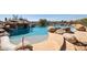 Luxury pool has natural rock design with easy access to the water from the stone patio at 12639 N 136Th St, Scottsdale, AZ 85259