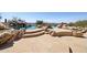 Beautiful pool area with stone patio features rock accents and desert views in a backyard oasis at 12639 N 136Th St, Scottsdale, AZ 85259