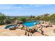 Desert home features a luxury pool and spa with rock features and mountain views at 12639 N 136Th St, Scottsdale, AZ 85259