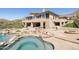 Custom pool and spa combination features beautiful rock accents, surrounded by a flagstone patio at 12639 N 136Th St, Scottsdale, AZ 85259