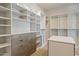 Spacious walk-in closet with custom shelving, drawers, and ample storage for an organized wardrobe at 12639 N 136Th St, Scottsdale, AZ 85259