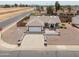 Single-Gathering home features a spacious driveway, two-car garage, desert landscaping, and a private, fenced yard at 1297 E Avenida Kino --, Casa Grande, AZ 85122