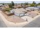 A charming single-story home boasts desert landscaping, an extended driveway, and a private, fenced backyard at 1297 E Avenida Kino --, Casa Grande, AZ 85122