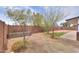 Backyard featuring brick fencing and desert landscaping with young trees at 1297 E Avenida Kino --, Casa Grande, AZ 85122