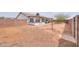 Generous backyard with covered patio, bordered by a privacy fence at 1297 E Avenida Kino --, Casa Grande, AZ 85122