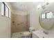 A bathroom with tile, grab bars and a walk-in shower at 1297 E Avenida Kino --, Casa Grande, AZ 85122