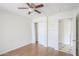 A bedroom with a wood-look floor, a closet and a view into the hallway at 1297 E Avenida Kino --, Casa Grande, AZ 85122