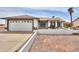 Charming single-story home with a well-maintained front yard and two-car garage at 1297 E Avenida Kino --, Casa Grande, AZ 85122