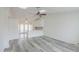 Open layout featuring stylish flooring, skylight, white cabinetry, and breakfast bar at 1297 E Avenida Kino --, Casa Grande, AZ 85122