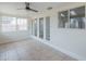 A sun room with tile flooring, windows and glass pane doors at 1297 E Avenida Kino --, Casa Grande, AZ 85122