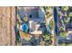Drone view of the property with a sparkling pool, spacious backyard, and circular driveway at 14022 W Hope Dr, Surprise, AZ 85379