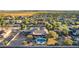 Expansive aerial view featuring a backyard pool, lush landscaping, and desert scenery at 14022 W Hope Dr, Surprise, AZ 85379
