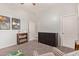 ' bedroom featuring a bookshelf, dark wood furniture and neutral carpet at 14022 W Hope Dr, Surprise, AZ 85379
