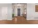 Bright and inviting foyer with hardwood floors, a stylish front door, and neutral color scheme at 14022 W Hope Dr, Surprise, AZ 85379